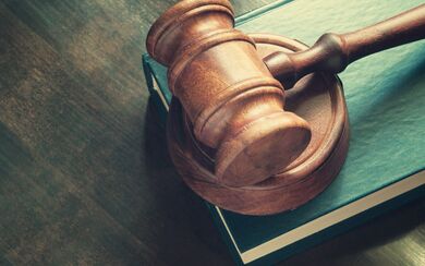 A gavel on a book