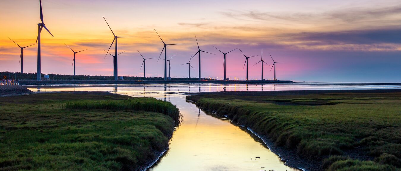 Scenery of Gaomei Wetlands wind turbines during golden hour in Taichung