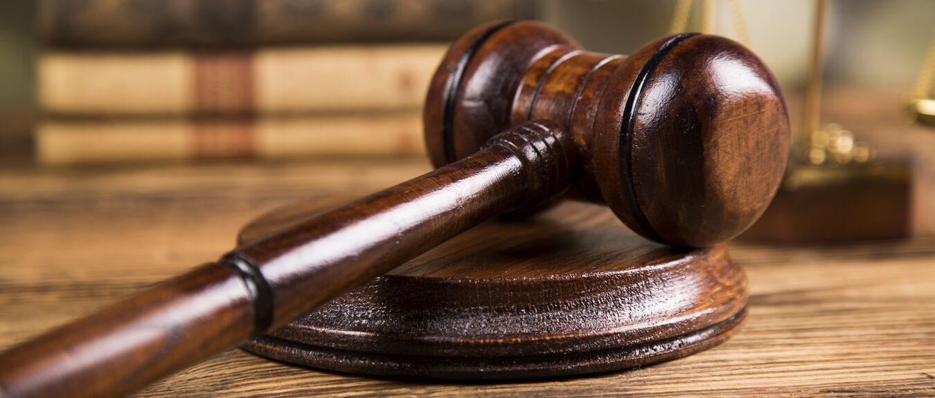 Gavel, Golden scales of justice on desk
